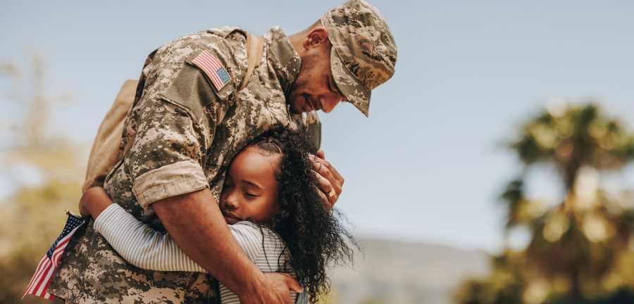 veteran hugging daughter